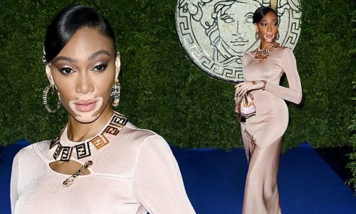 Winnie Harlow showcases her impeccable in figure-hugging nude dress