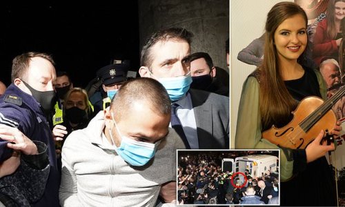 Murder accused, 31, is pushed through crowd on his way into court after being charged with killing Irish primary school teacher Ashling Murphy, before her family silently hold up the 23-year-old's picture during hearing