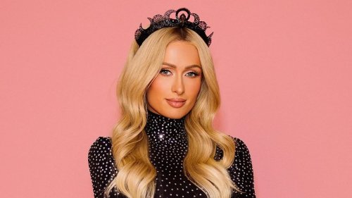 Paris Hilton looks stunning in chic goth look with a black tiara and pleated leather skirt... after...
