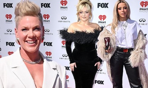 Heidi Klum puts on a busty display in a sultry blue gown while Pink and Bebe Rexha stun in glamorous looks as they lead stars at iHeartRadio Music Awards