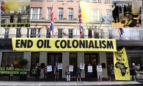 Eco-mob storm London's May Fair Hotel and glue themselves together in lobby: Extinction Rebellion activists spray black paint over entrance and unfurl 'End Oil Colonialism' banner during energy summit at £351-a-night hotel
