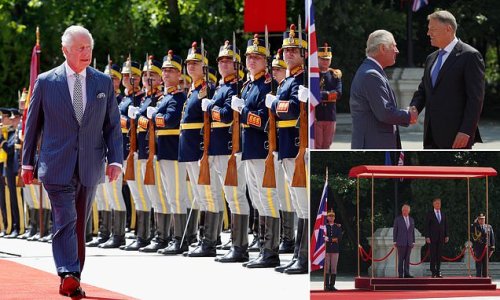 King Charles inspects Romanian guard of honour and meets the country's president as he begins first overseas visit since his coronation