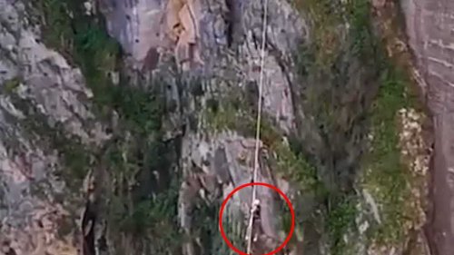 Tourist is trapped on 200ft-high zipline for 90 minutes after getting caught on Spanish highwire ride