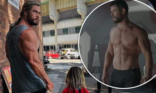 Thor star Chris Hemsworth flaunts his bulging biceps on set with son