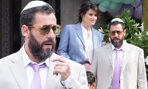 Adam Sandler looks sharp in a beige suit while reuniting with Idina Menzel on the Toronto set of You Are SO Not Invited To My Bat Mitzvah!