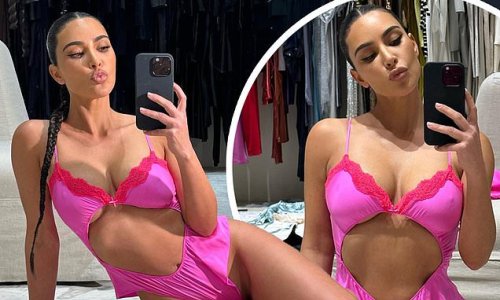 Valentine's Day vixen! Kim Kardashian flashes tiny tummy and hint of underboob in flirty cut-out teddy as sister Kylie Jenner says she 'needs' this look