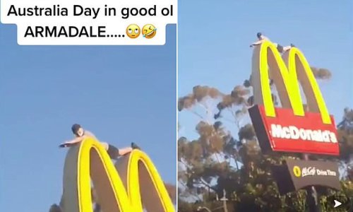 Bizarre moment man lies on top of the golden arches of McDonald's sign