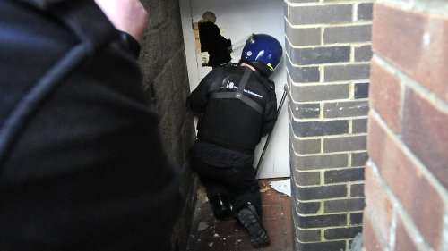 Moment Home Office cops kick down door in people-smuggling gang raid