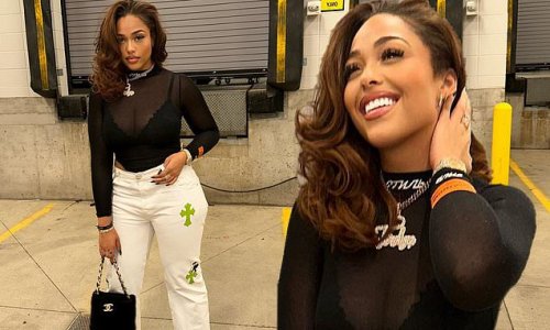 Jordyn Woods Flaunts Her Fit Physique In A Sheer Black Bodysuit While Flashing A Luxurious 