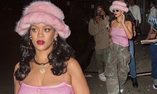 Rihanna goes braless under pastel pink top paired with a furry hat