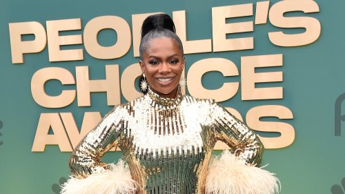 Kandi Burruss glitters in gold at People's Choice Awards where she's competing against Kim...