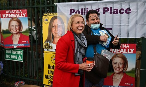 Hilarious moment Liberal volunteer poses for a selfie with Kristina Keneally as she looks to grind out a victory in south-west Sydney far from her home on an island