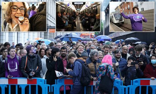 On board the historic first Elizabeth Line service from Paddington: MailOnline joins hundreds of die-hard rail enthusiasts who dyed their hair purple, brought novelty cakes and queued since MIDNIGHT to get a seat on 6.33am service to Abbey Wood