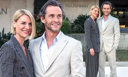 Claire Danes and husband Hugh Dancy match in his and hers suits as they cozy up for snaps at Max Mara event in Lisbon, Portugal