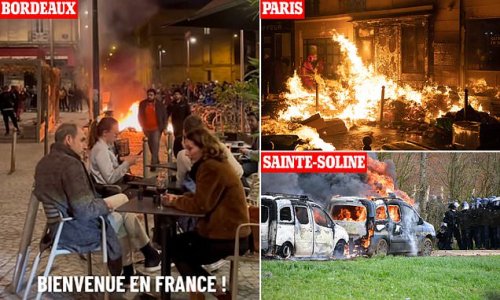 Keep calm and carry on: Unfazed French diners enjoy glass of wine with fires still burning in the background as violent protests over pensions rage across the country