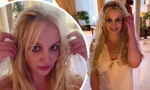 Britney Spears posts explosive, expletive-filled rant aimed at an unnamed 'famous person'... after sharing bizarre clip modeling her 'great great grandmother's veil'
