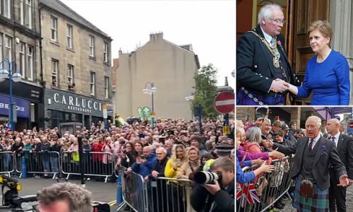 Nicola Sturgeon’s frosty reception: Scotland’s First Minister is booed and whistled by crowd as she arrives in Dunfermline for city-making ceremony – while King Charles is greeted by fans waving Union flags