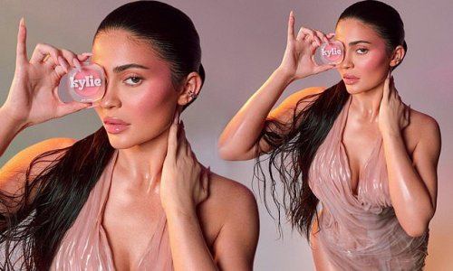 'A juicy, wet look': Kylie Jenner proves she has lost those 60lbs from her second pregnancy as she poses in a pink dress to promote her lip gloss