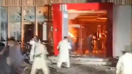Mayhem as armed rioters torch KFC in Pakistan amid reports of gunfire