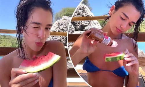Makeup-free Dua Lipa displays her slender frame in a skimpy blue bikini as she films herself eating a pepper-sprinkled watermelon