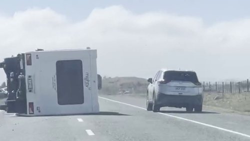 Campervan blown over on a busy road in New Zealand with a young family inside