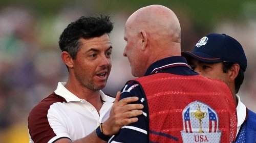 The caddie who enraged Rory McIlroy in Ryder Cup 'cheating row': Northern Irish golfer's f-word altercation was sparked by American waving his cap in his face on the final green as bad blood tarnishes tournament