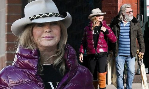 Goldie Hawn bundles up in puffer jacket and cowboy hat as she does