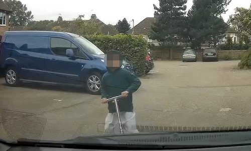 Hair-raising moment small child on scooter shoots out in front of car
