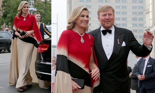 Regal in red! Queen Maxima of the Netherlands cuts a striking figure in a scarlet and cream dress as she joins King Willem-Alexander to meet the Dutch chamber choir at Konzerthaus concert hall in Vienna