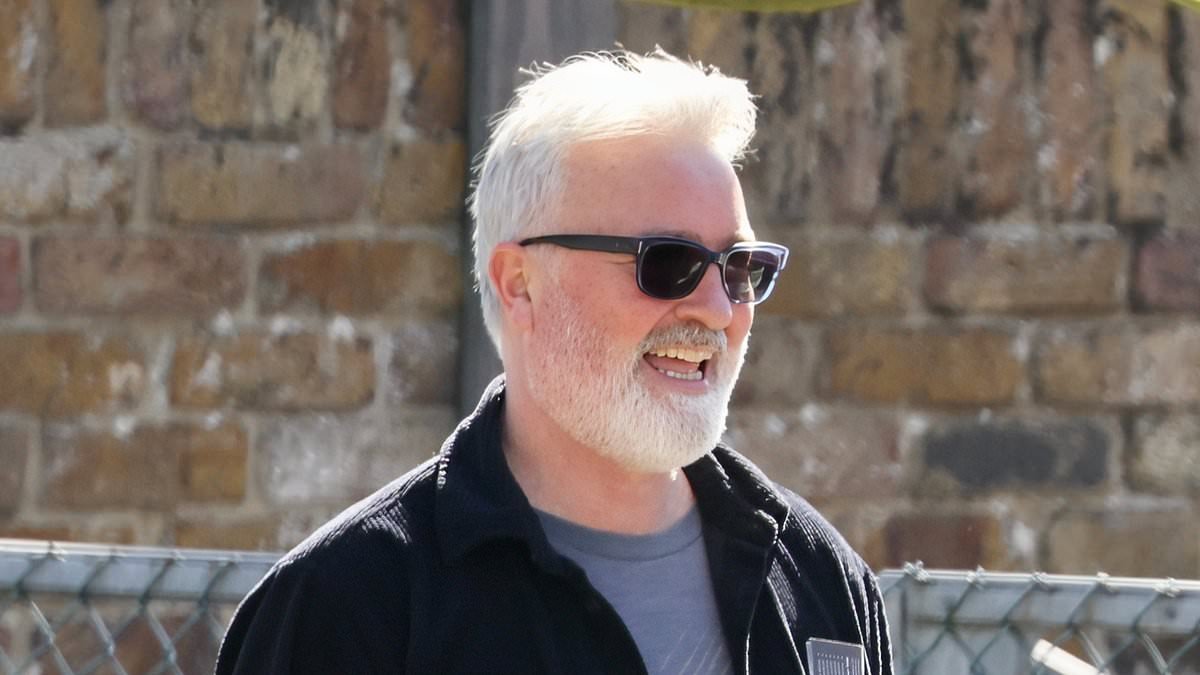 TV star looks unrecognisable with grey hair and a thick beard as he runs errands - but can you guess who he is?