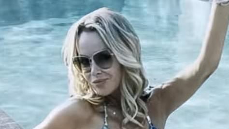 Amanda Holden sets pulses racing as she strips down to a skimpy blue leopard print bikini as she unveils exciting home update