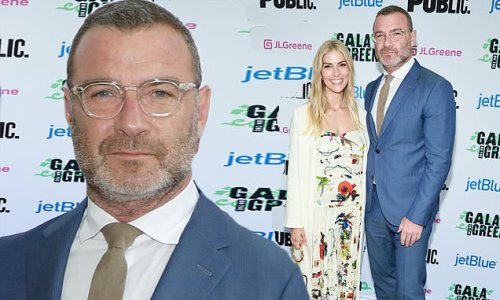 Liev Schreiber, 54, looks suave in a fitted blue suit beside stunning girlfriend Taylor Neisen, 28, as they attend this year's Public Theater Gala On The Green in NYC