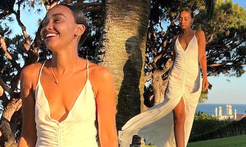 'You had us!' Leigh-Anne Pinnock sends fans into a frenzy as she posts a beachside snap in a white dress - jesting 'just Marri...kidding'