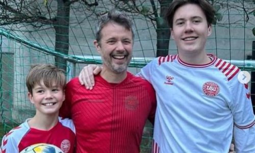 Denmark royals Prince Frederik and his sons play football in the national team's shirts as they clash with Socceroos - but there is NO sign of Aussie-born Princess Mary