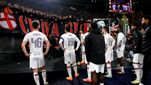 AC Milan players are confronted by the club's ultras after their defeat to Roma in the Europa...