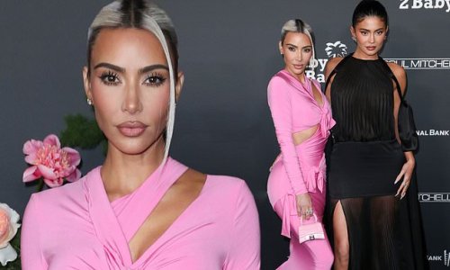 Kim Kardashian is pink perfection in a vibrant curve-clinging gown while sister Kylie Jenner stuns in a flowy sheer black dress as they lead stars at the 2022 Baby2Baby Gala... as Kim is given charity's highest honor of the night