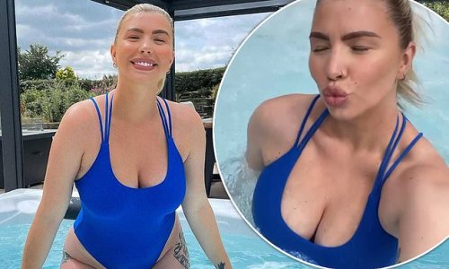 'Water baby!': Olivia Bowen looks sensational in a swimsuit as she takes a dip in her hot tub four weeks after welcoming son Abel