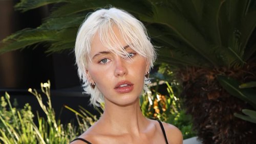 Iris Law flashes her sideboob in a black bejewelled midi dress as she turns heads during Cannes Film Festival
