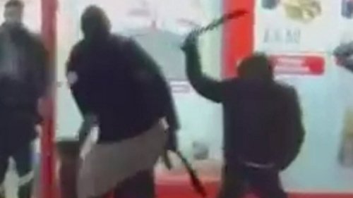 Moment machete fight breaks out near to Premier League football stadium as youths slash at each other with huge blades