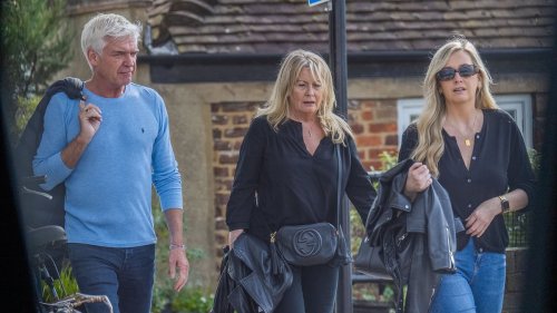 Phillip Schofield is seen publicly for the first time with his wife and daughter since he quit This Morning over affair scandal - after he was spotted heading into hotel with a mystery man