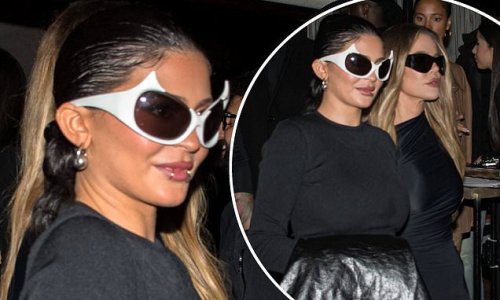 Kylie Jenner shows off her curves in a form-fitting bodycon as she dines out with half-sister Khloé Kardashian at upscale French bistro during Paris Fashion Week