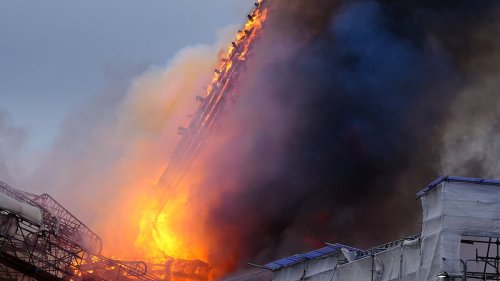 Copenhagen's historic stock exchange building goes up in flames and its iconic spire destroyed as...