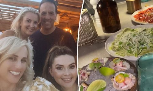 Rebel Wilson indulges in a decadent seafood meal with pals on vacation in Turkey as it's claimed she 'doesn't want to lose any more weight' after dropping an impressive 35kg