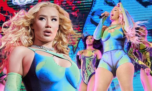 Iggy Azalea shows off her curves in a neon crop top and matching bike shorts during Pitbull's Can't Stop Us Now Tour in Toronto