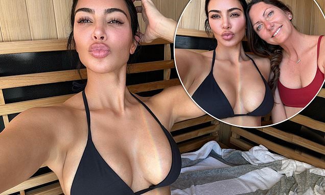 Kim Kardashian shows off her jaw-dropping figure in a busty black bikini as  she pouts for a selfie while relaxing with close friend Natalie in the sauna  | Flipboard