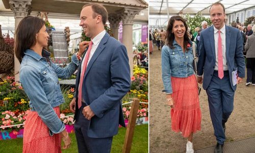At least someone's come up smelling of roses! Ex-health secretary Matt Hancock visits Chelsea Flower Show with partner Gina Coladangelo - as MPs face grilling over Partygate