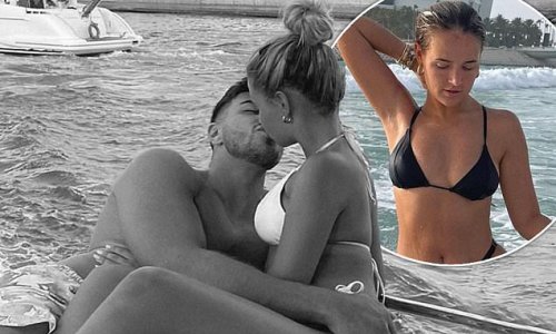 'Forever thing': Molly-Mae Hague and Tommy Fury share a passionate kiss as the loved-up couple pack on the PDA on their lavish holiday in Dubai