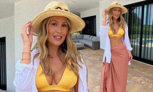 Kate Ferdinand flashes her toned midriff and ample assets in yellow bikini and pink sarong