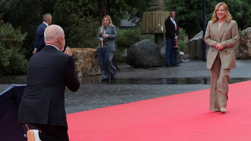 Quite the contrast! Moment Albania's 6ft 7in Prime Minister gushingly takes a knee as he meets Italy's 5ft 3in PM - days after towering over Keir Starmer during their meeting in Tirana