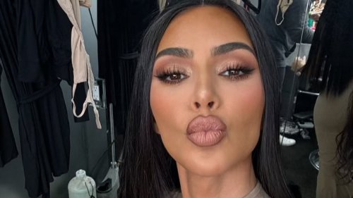 Kim Kardashian shows off her Christmas decorations with the tree-lined driveway of her minimalist...